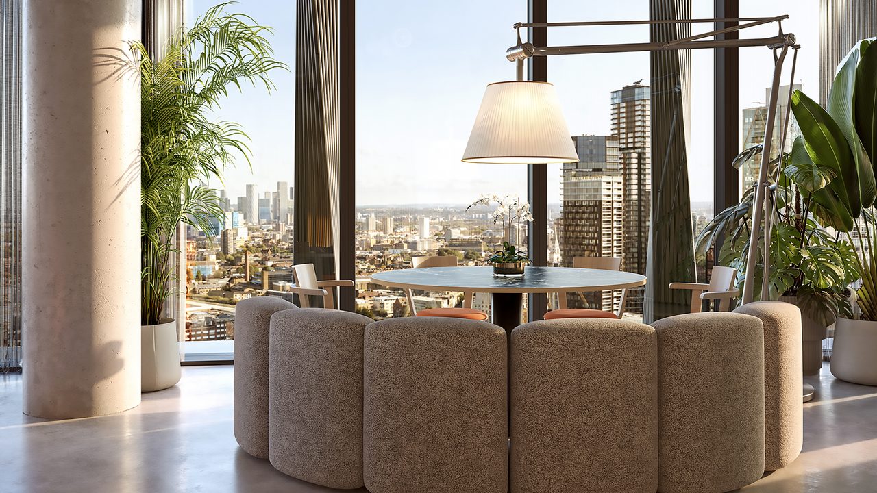 A circular meeting nook with floor-to-ceiling views across London